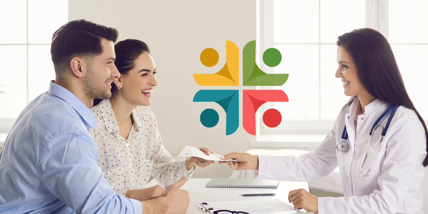 A happy couple at a consultation with a doctor for in vitro fertilization