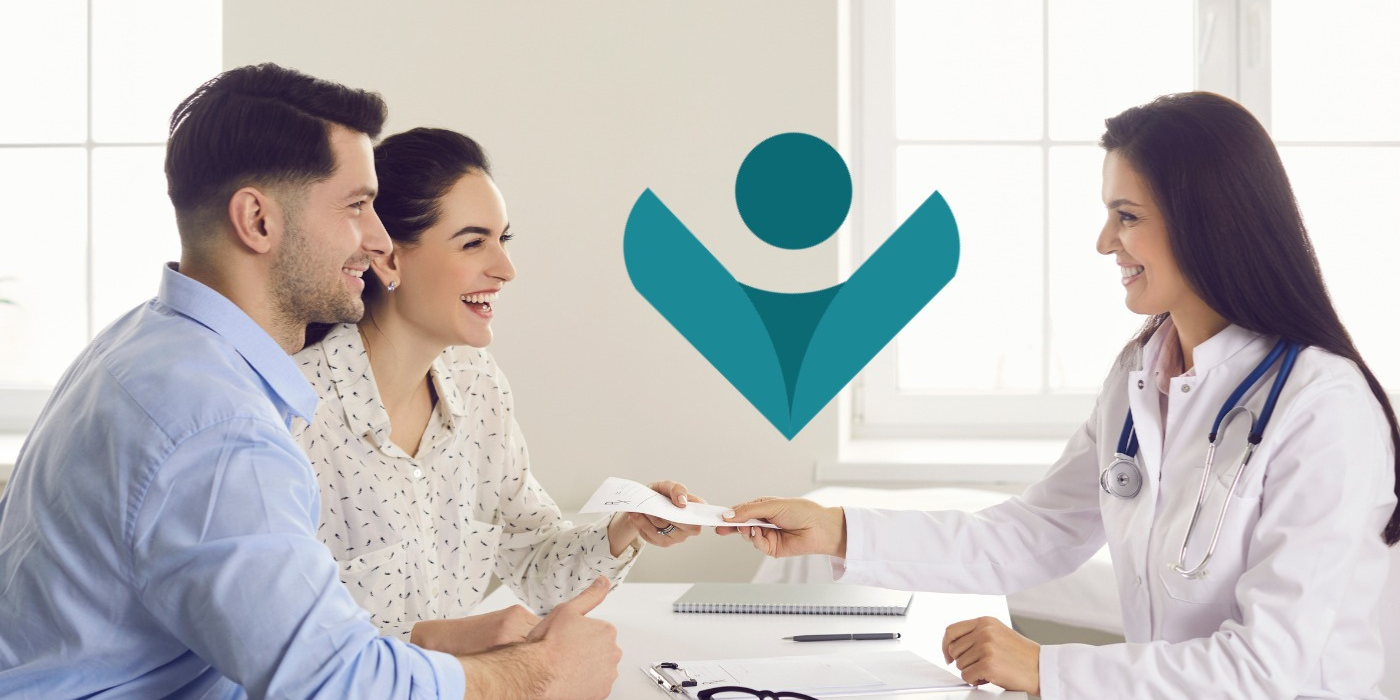 A happy couple at a consultation with a doctor for in vitro fertilization