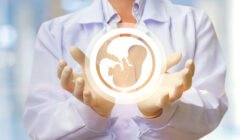A doctor in a white coat and sterile gloves holds a symbolic hologram of an embryo in their hands, representing the in vitro fertilization and embryo transfer process.